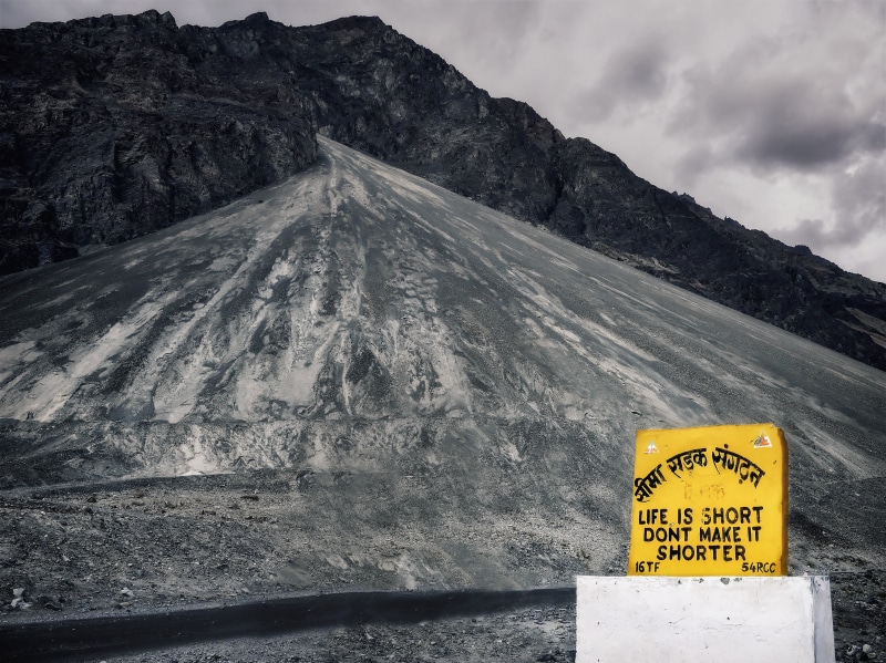 outdoors, transportation, india, mountain range, mood, text, beauty in nature, mountain, day, nubra, message, shield, no people, nature, cloud - sky, road