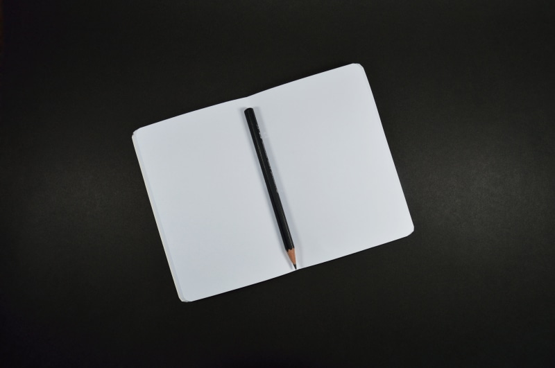 office, copy space, desk, writing, indoors, black background, message, close-up, simplicity, studio shot, notebook, document, single object, 5K, high angle view