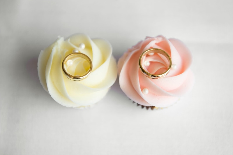 flowering plant, wedding ring, emotion, marriage, two, nature, studio shot, cake, decors, egg, indoors, freshness, wedding rings, gold, event, party, beauty in nature