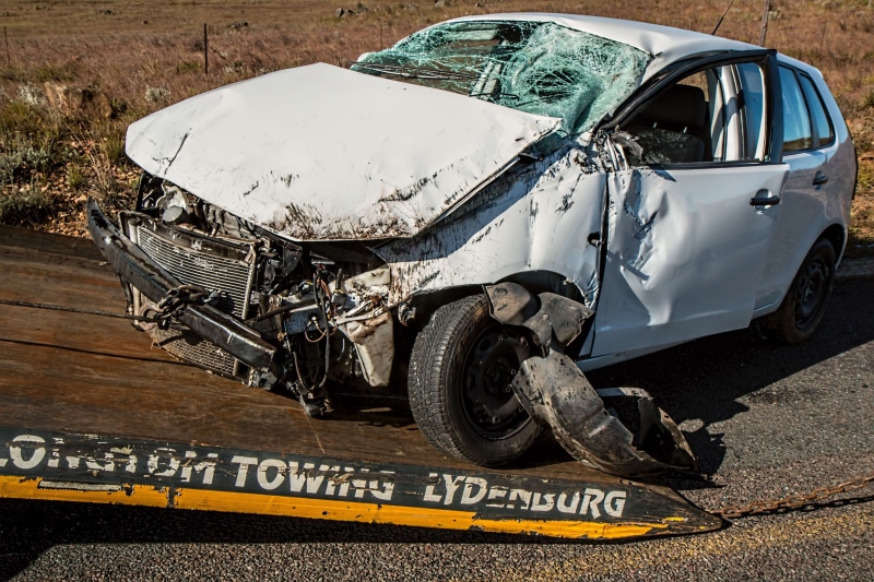 outdoors, land vehicle, day, damaged, auto accident, car accident, western script, smash, stationary, broken, communication, insurance, wreck, mode of transportation