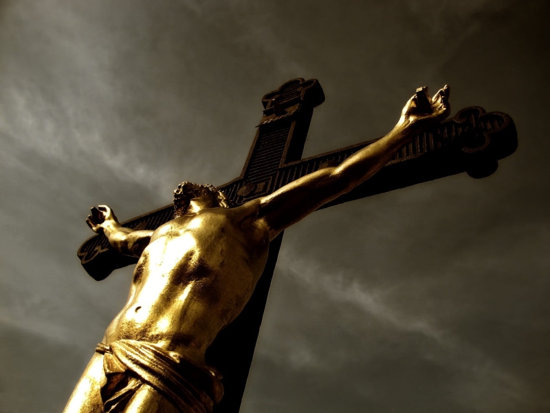 low angle view, photography, faith, symbol, meditation, cloud - sky, architecture, holy, human representation, male likeness, belief, religion, sword, sacrifice