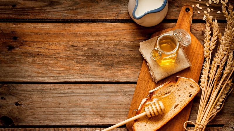 no people, drink, wood, honey, toast, still life, rustic, breakfast, directly above, household equipment, table, dairy product, kitchen utensil, refreshment
