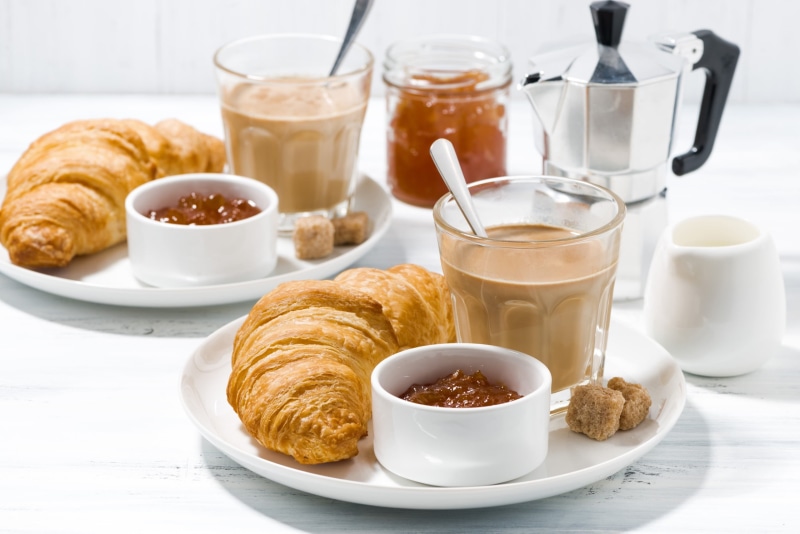 croissant, breakfast, coffee - drink, indoors, hot drink, cup, drink, table, coffee cup, mug, coffee, baked, 2K, bread, food, no people, glass, ready-to-eat