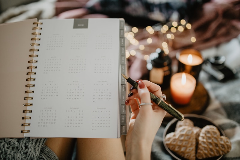 women, human body part, skill, girl, young adult, hand, writing, coffee, bed, paper, cosy, lying, work, gingerbreads, high angle view, selective focus