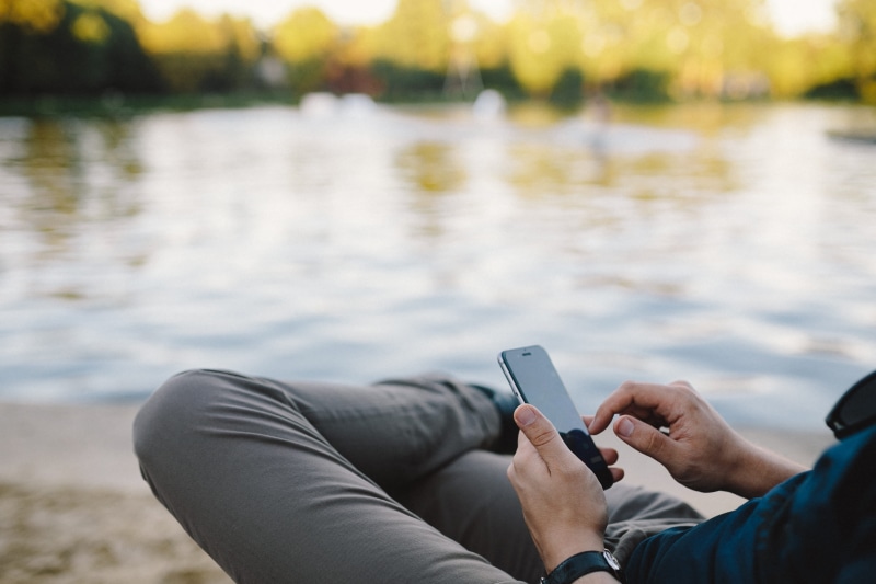 Man, park - Man Made Space, Young, sitting, adult, outdoor, touch Screen, using phone, human Hand, connection, receiving, mobile, relaxation, portability