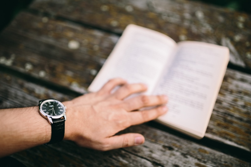 activity, paper, wristwatch, bible, focus on foreground, human body part, lifestyles, relaxing, lake, opened book, spirituality, Reading book, leisure activity