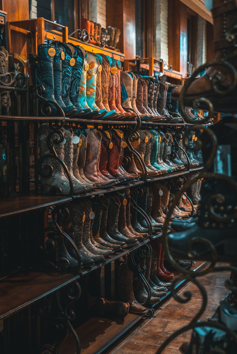 boots, cowgirl boot, cowboy hat, for sale, cowboy boot, rack, variation, cowboy, side by side, costume, brown, order, photo, leather, retail display, shelves