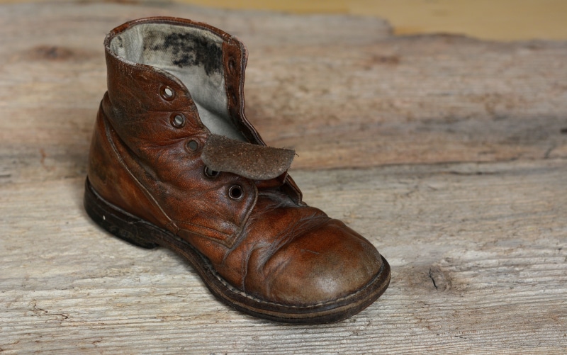 animal themes, wood - Material, no people, brown, old, worn, weathered, age shoe, focus on foreground, antique, animal, used, shoe, flooring, day, boot