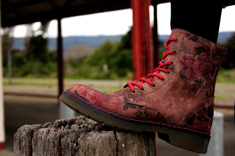 animal representation, foot, riding boot, focus on foreground, new zealand, absence, floral, clothing, shoe, 5K, personal accessory, unpaired, close-up