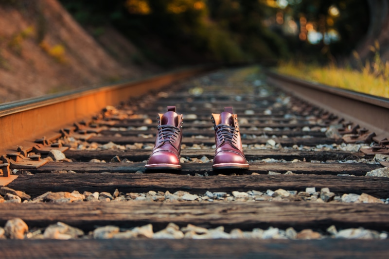 shoe, diminishing perspective, footwear, nature, boot, trainline, selective focus, s, railway track, daytime, pair, railroad track, boots, brown, bokeh