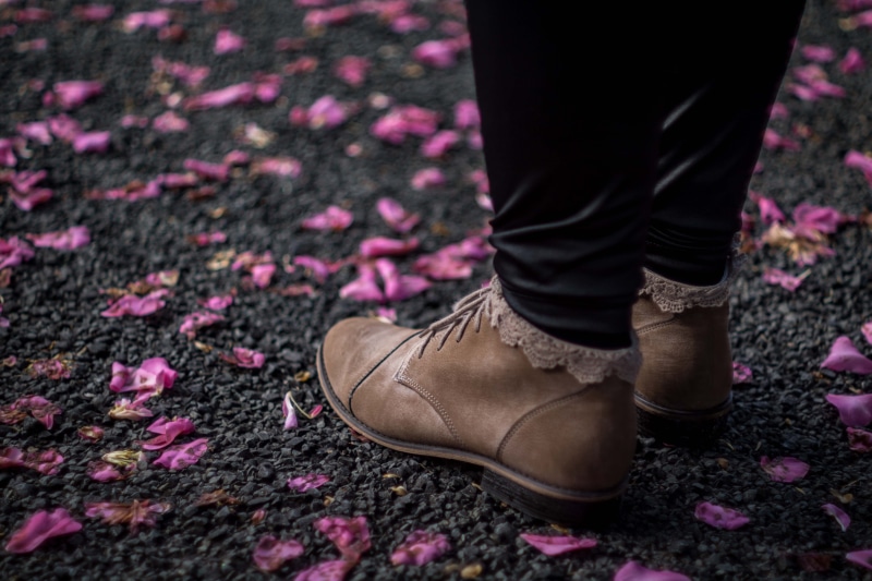 chukka, outdoors, close-up, journey, standing, adult, pink, limb, person, lace, dress shoe, body part, day, flower, purple, boots, petal, boot, brown, human body part