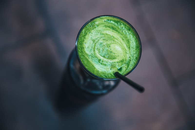 high angle view, liquid, leaf, raw, glass, close-up, diet, juice, food, shake, refreshment, focus on foreground, green color, health, antioxidant, fresh