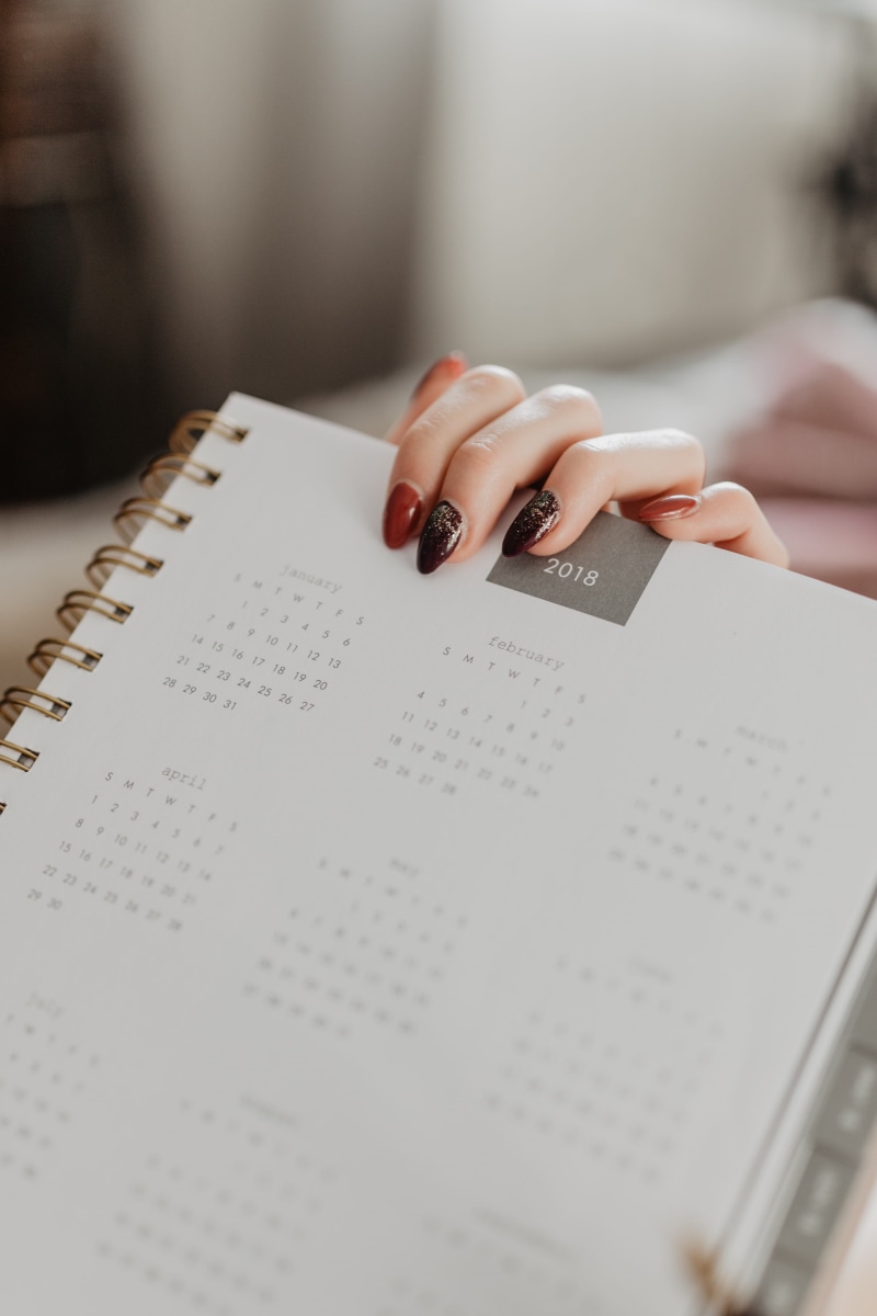 candles, notebook, cozy, focus on foreground, finger, communication, girl, cosy, book, coffee, lying, work, woman, indoors, hand, workspace, human body part