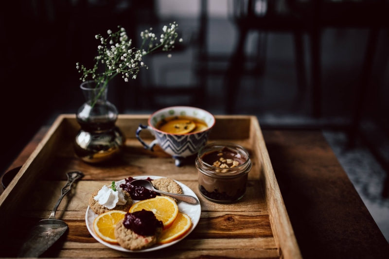 food, orange, cookies, fruit, cup, vase, spoon, tea, table, Room service, bowl, kitchen utensil, meal, food And Drink, chocolate mousse, tea, 4K, flower
