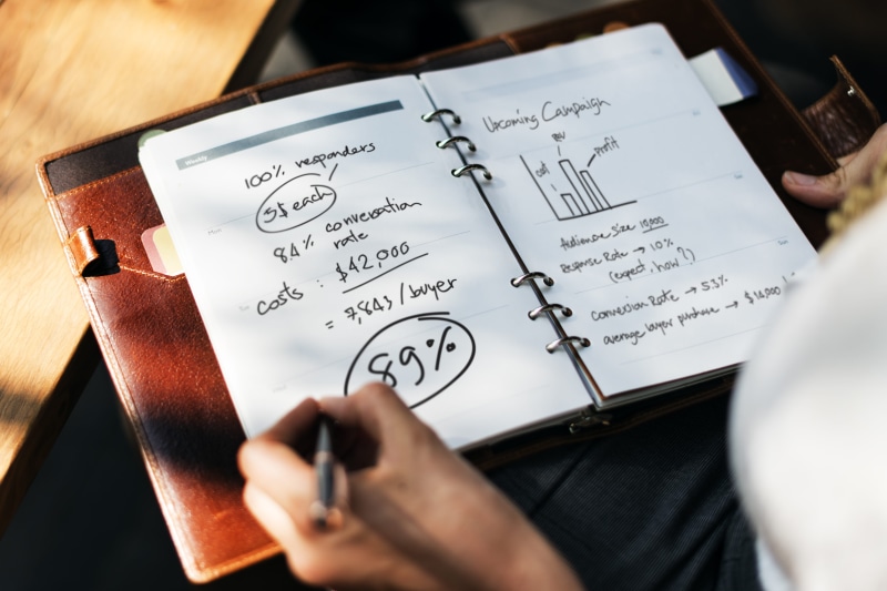 indoors, page, one person, publication, pen, holding, analytics, write, education, numbers, finance, success, student, planning, planner, writing, real people