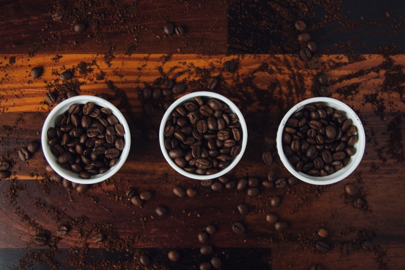 coffee, directly above, wood - Material, wooden table, backgrounds, cup, high angle view, coffee bean, roasted coffee bean, large group of objects, table