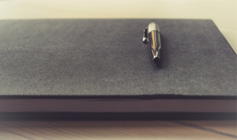 writing instrument, click, jewelry, connection, metal, black, 2K, two objects, table, personal accessory, simplicity, furniture, indoors, book, close-up