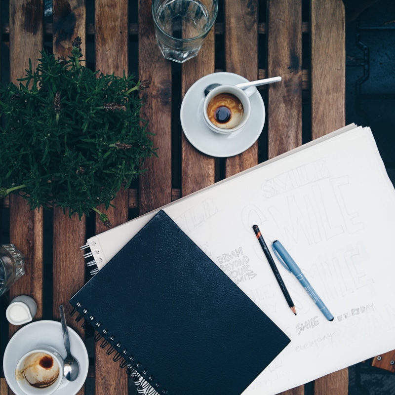 pen, coffee - Drink, no people, drink, indoors, paper, wood, top view, coffee, glass, equipment, caf, meeting, table, high angle view, pencil, book, desk