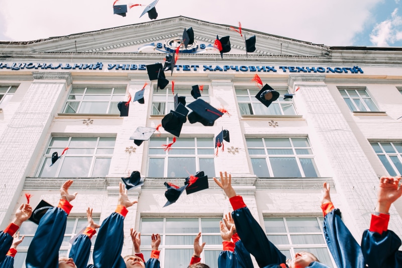 adult, cap, huzzah, university, academic, human, crowd, arms raised, human limb, large group of people, education, nature, built structure, limb, campus