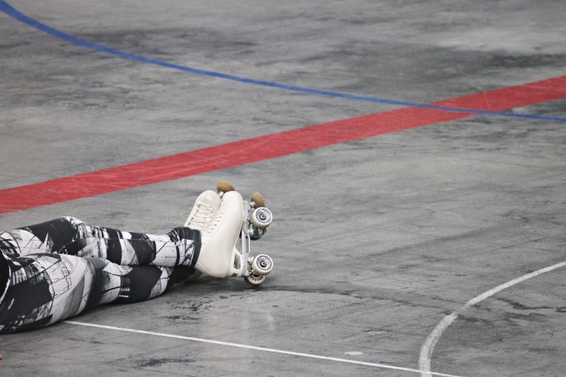 transportation, relaxation, training, symbol, sign, hall floor, street, rest, roller skates, sit, roller-skating, sport, day, tired, human body part, full length