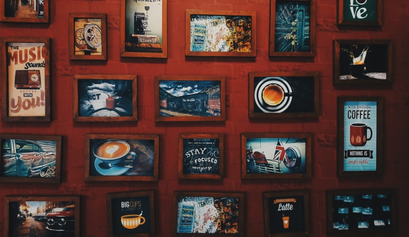 brick, no people, trademark, non-western script, architecture, museum, retail display, frame, collection, indoors, art and craft, script, drak, photo, arrangement