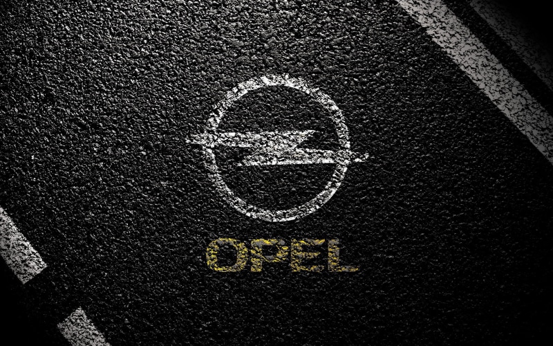 logo, sign, outdoors, high angle view, road, art and craft, 1080P, Vauxhall, communication, General Motors, white color, representation, asphalt, road marking