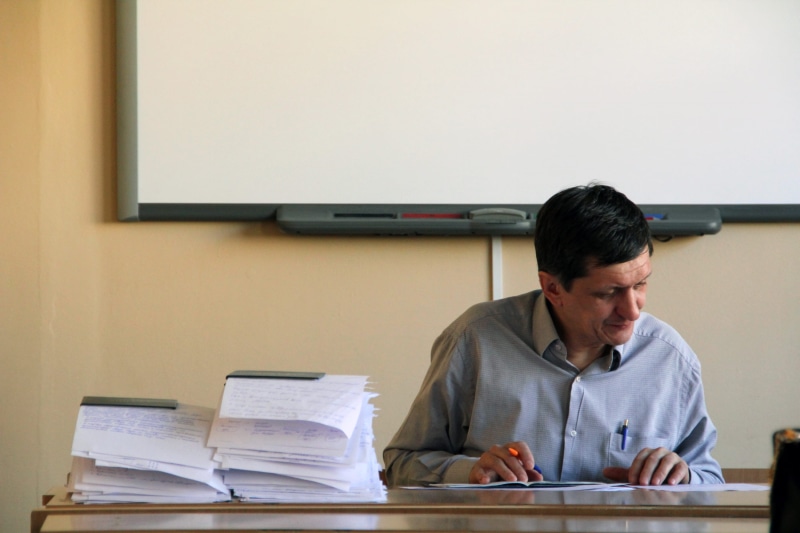 school, indoors, one person, mature men, whiteboard, man, university, lesson, concentration, learning, education, highschool, scientific, paper, class