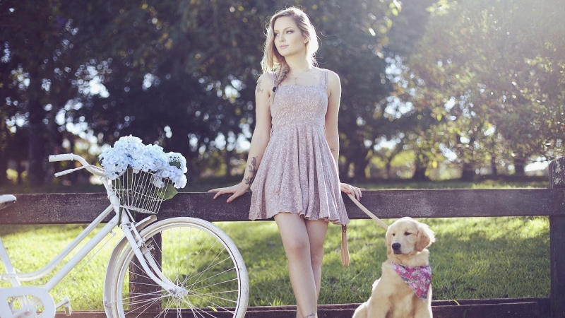 lifestyles, domestic animals, model, happiness, cute, dress, tattoo, looking away, tree, fun, domestic, women with bicycles, white, strap, dog, adult, caucasian Ethnicity