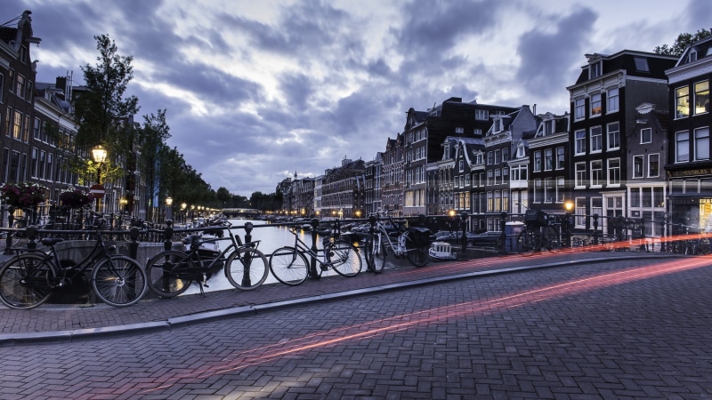 illuminated, Netherlands, cloud - sky, connection, bicycles, house, building, built structure, nature, building exterior, bicycle, land vehicle, water
