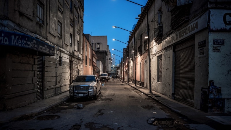car, urban, direction, no people, alley, architecture, facade, neighbourhood, clear sky, motor vehicle, outdoors, city, building, transportation, city street