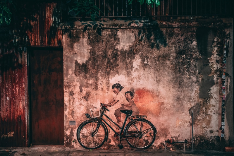old, building exterior, land vehicle, wall, urban Scene, 5K, street, dirty, bicycle, damaged, children, cycling, adult, architecture, no people, backgrounds
