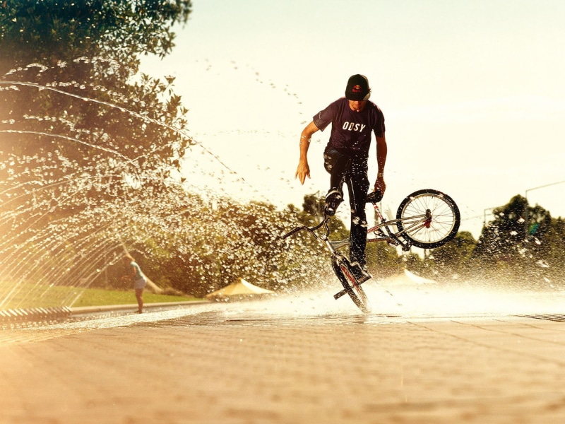 effort, sport, day, full length, real people, extreme sports, riding, transportation, motion, lifestyles, outdoors, sunlight, adventure, bicycle, men, sky