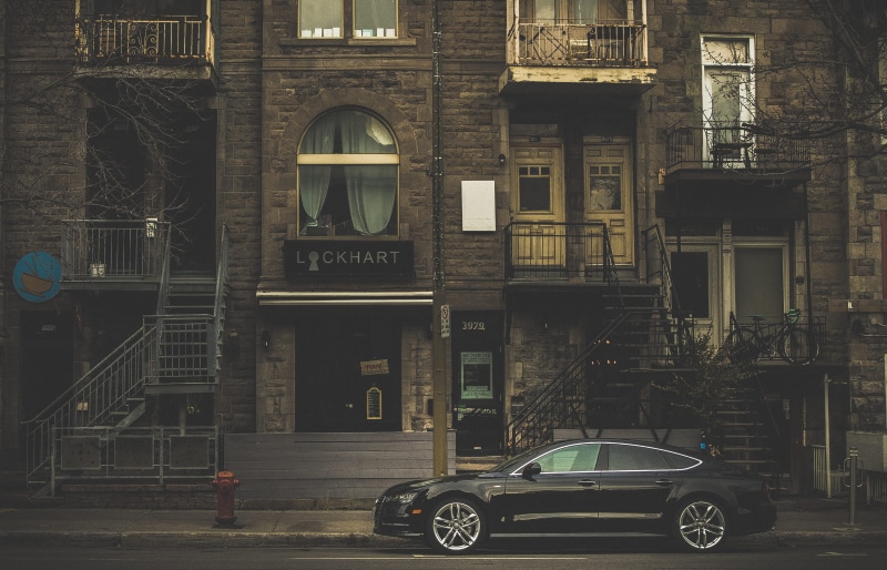 4K, no people, motor vehicle, day, black, city, mode of transportation, window, vehicle, parking, building exterior, near, land vehicle, daytime, road