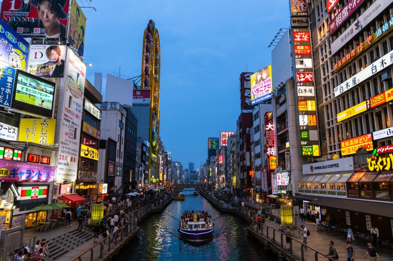 advertisement, canal, travel destinations, water, incidental people, architecture, 8K, sky, office building exterior, dotonbori river, mode of transportation