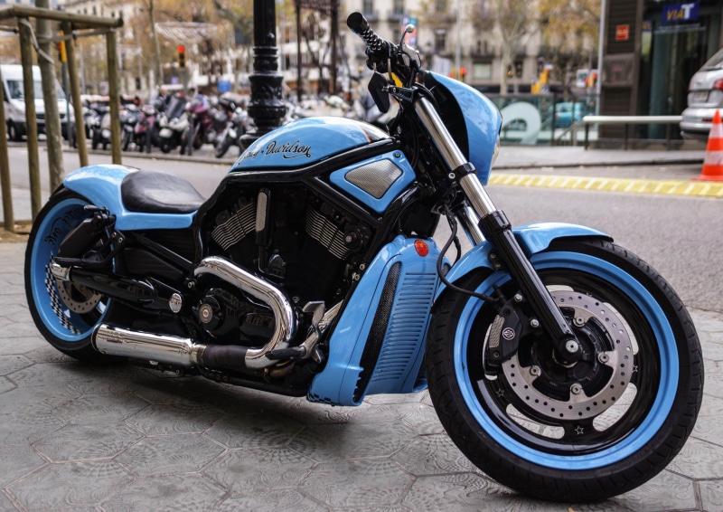 mode of transportation, chrome, blue, harley-davidson motor company, outdoors, architecture, parking, street, bike, road, tire, riding, wheel, day, crash helmet