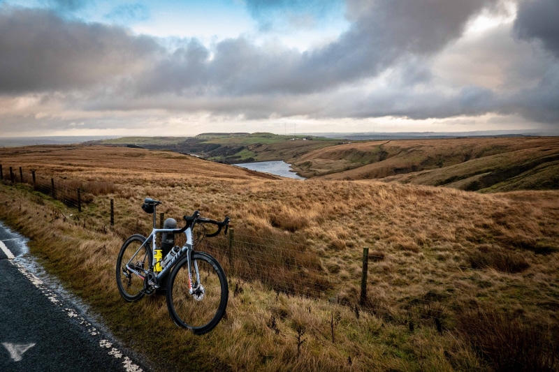 environment, black, building, vehicle, bmx, boat, travel, mountain bike, ground, outdoors, dirt road, bicycle, tranquil scene, gravel, beauty in nature