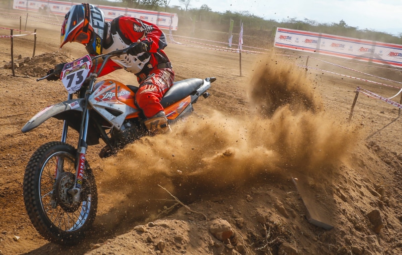 road, motorcyclist, vehicle, race, mud, motorcycle helmet, outdoors, bike rider, sports helmet, hurry, dirtbiker, biker, nature, competitive sport, headwear