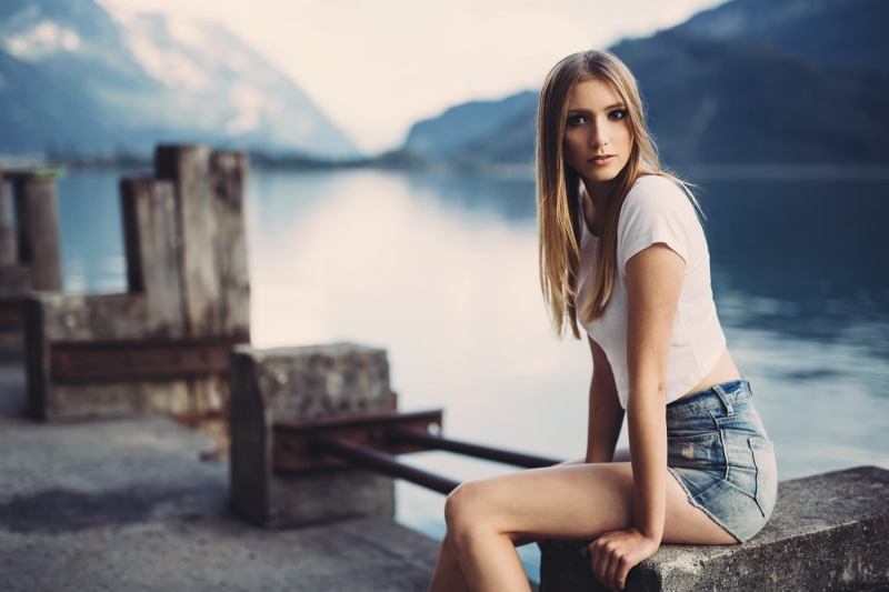 beautiful woman, near, shallow, scoop, portrait, young women, legs, long hair, focus on foreground, sitting, water, shirt, fashion, daytime, wearing, young adult