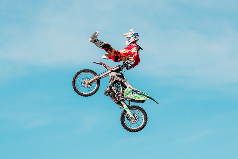 action, biker, stunt, extreme, jumping, in-flight, competition, stunt person, motorcycle Racing, riding, sport, sports Race, sports equipment, warning sign