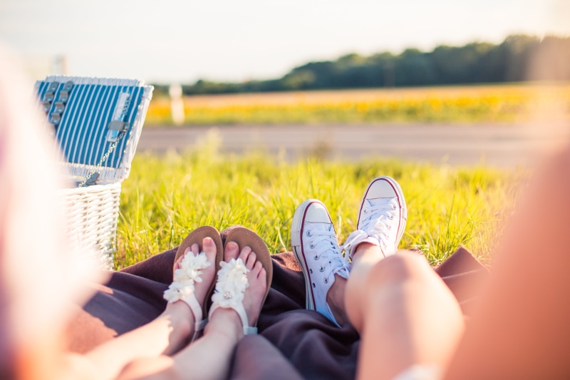 focus on background, vacations, people, young Adult, low section, human body part, field, Picnic, grass, men, chill out, couple - relationship, summer