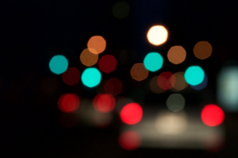 disco lights, brightly lit, projection, no people, glowing, illuminated, shape, defocused, spotted, bokeh, blurred, traffic, projection equipment, backgrounds