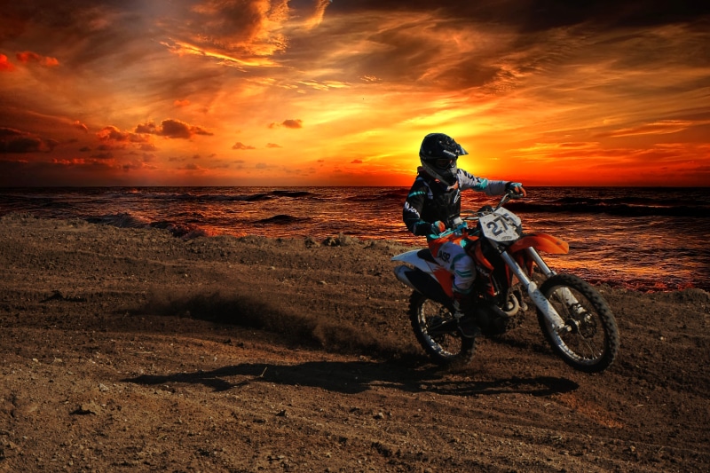 belize, sky, dirt bike, crash helmet, orange color, sea, bike, ocean, helmet, ktm, mode of transportation, spanish lookout, sunset, full length, riding