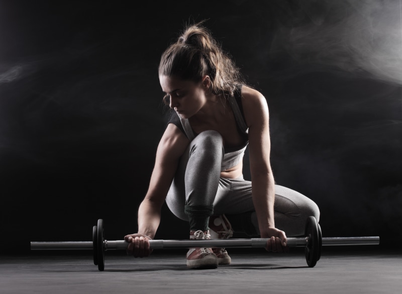 one person, indoors, weight, strength, muscular build, real people, sports training, full length, dark, black, athlete, sport, adult, weight training, healthy lifestyle