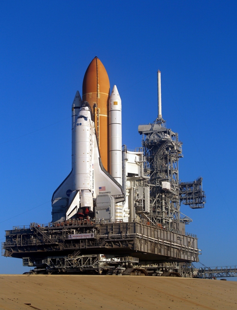 sky, travel, architecture, industry, outdoors, building exterior, mode of transportation, blue, flight, factory, brown, astronaut, bay, transportation