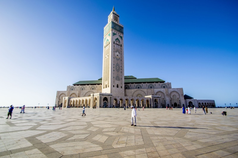 sky, outdoors, arabic Style, cultures, travel, mosque hassan 2, large group of people, building exterior, 4K, clear sky, history, architecture, the past