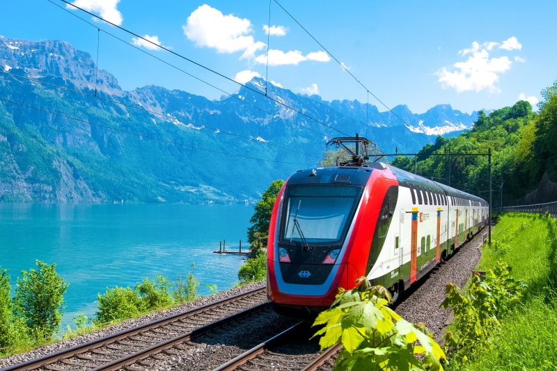 electricity, near, lake walen, mountain range, red, water, churfirsten, 2K, track, rail transportation, sky, mode of transportation, plant, no people