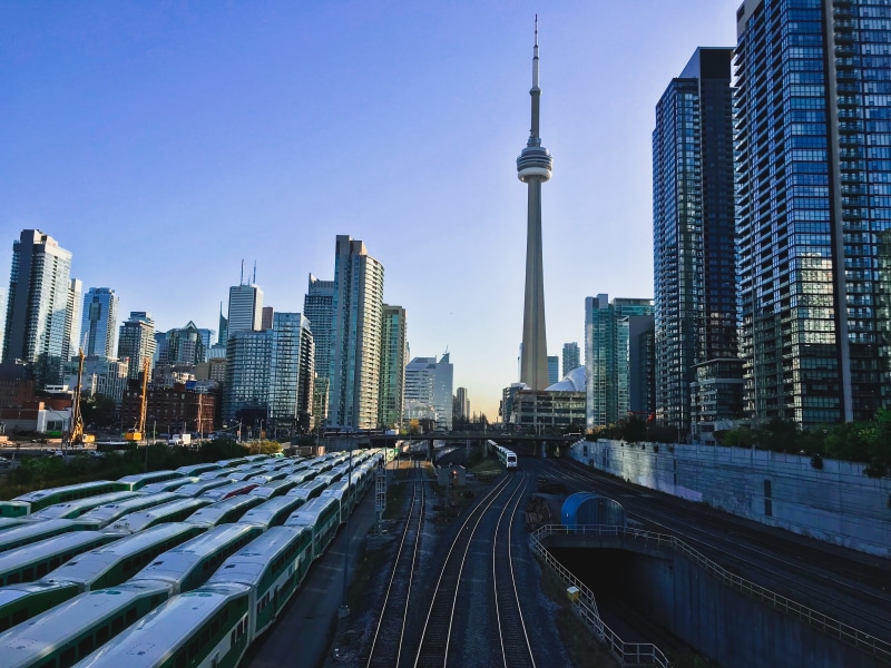 building exterior, train, tall - high, financial district, spire, no people, outdoors, modern, train - vehicle, 4K, cityscape, cn tower, architecture