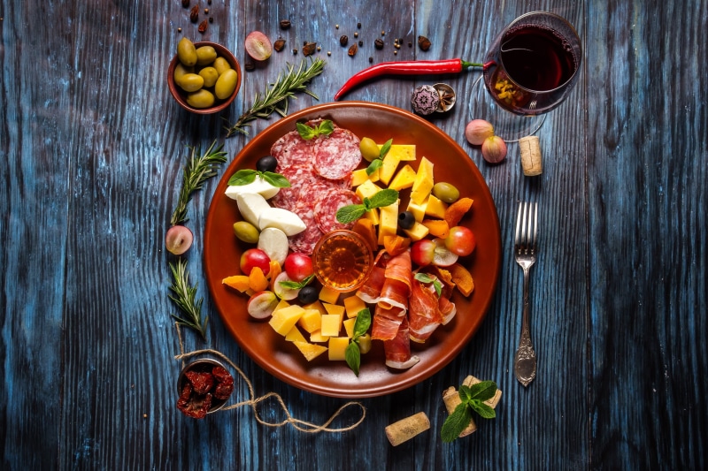 tomato, wellbeing, plates, garnish, table, eating utensil, bowl, fruit, indoors, ready-to-eat, wooden surface, kitchen utensil, crockery, still life, fork