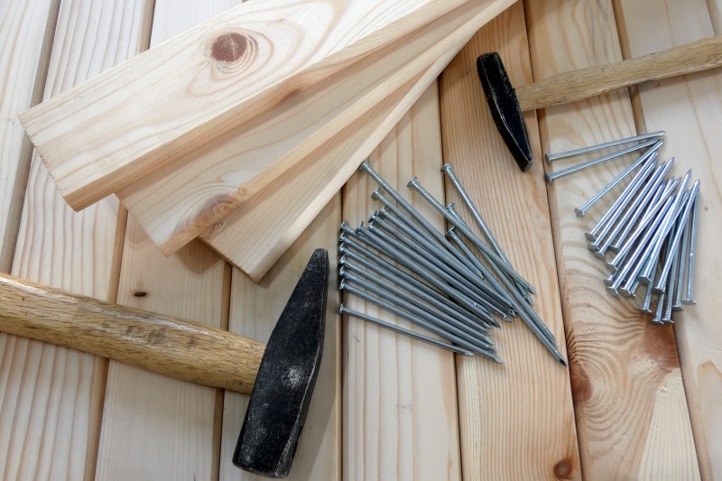 close-up, indoors, fork, raw food, hammers, table, build, no people, traditional, work tool, design, wooden, hammer, planks, eating utensil, directly above