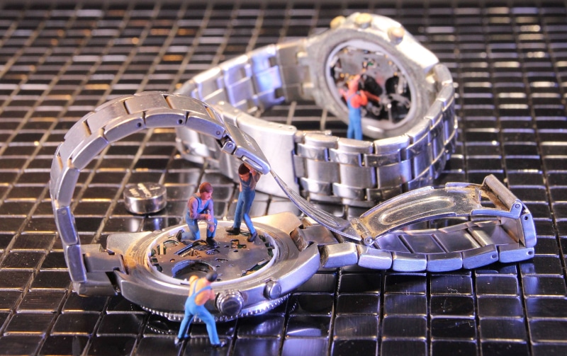 stack, clock, wheel, still life, craftsmen, focus on foreground, miniature figure, metal, teamwork, high angle view, day, tool, work clothes, security